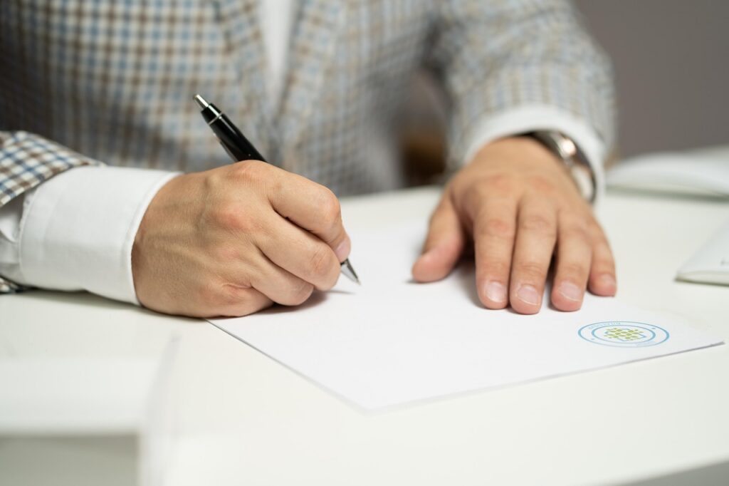 Small business owner reviewing an MCA personal guarantee contract at a desk