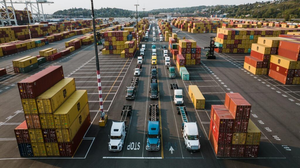 Small trucking fleet at freight terminal facing MCA cash flow pressure