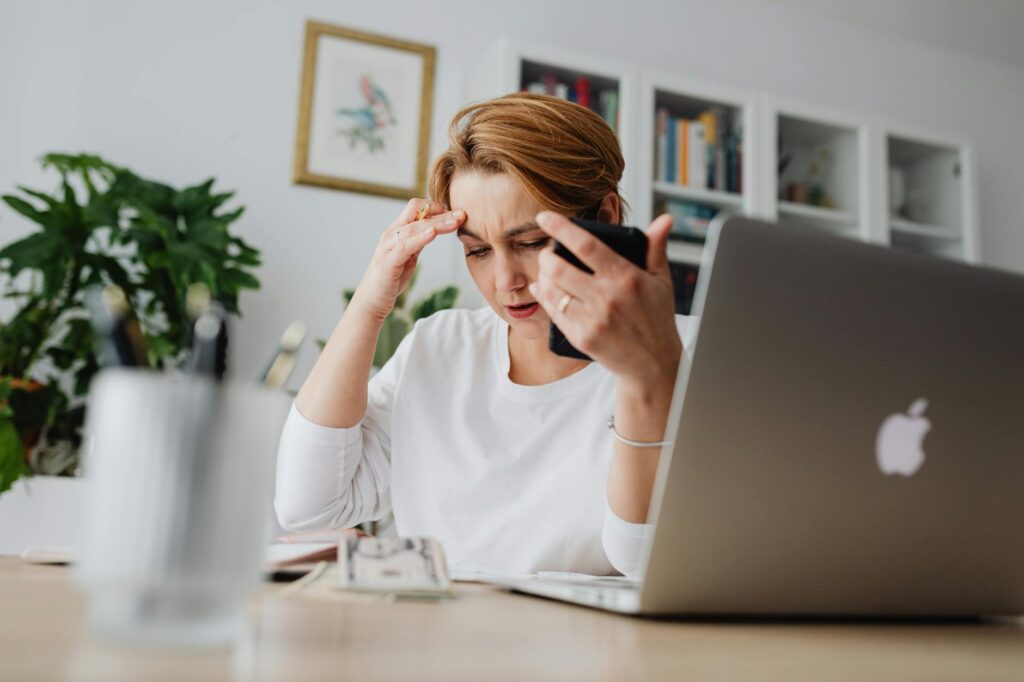 Business owner receiving urgent calls after MCA debit bounces