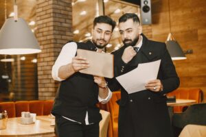 Restaurant owner reviewing MCA debt and cash flow problems before service