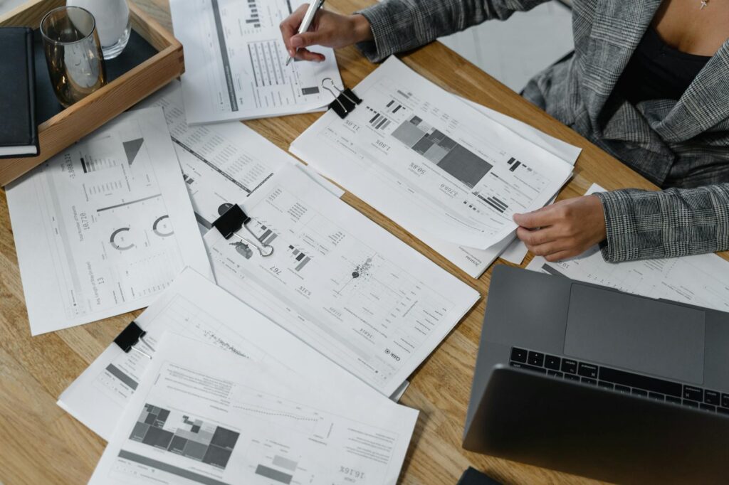 Owner reviewing deposit and debit figures on a spreadsheet
