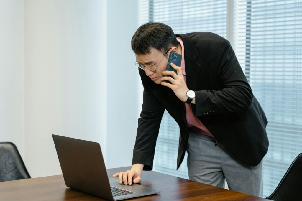 Business owner contacting MCA options specialist to respond to default situation