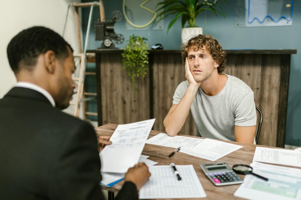 Business owner evaluating reverse consolidation offer versus other MCA debt options