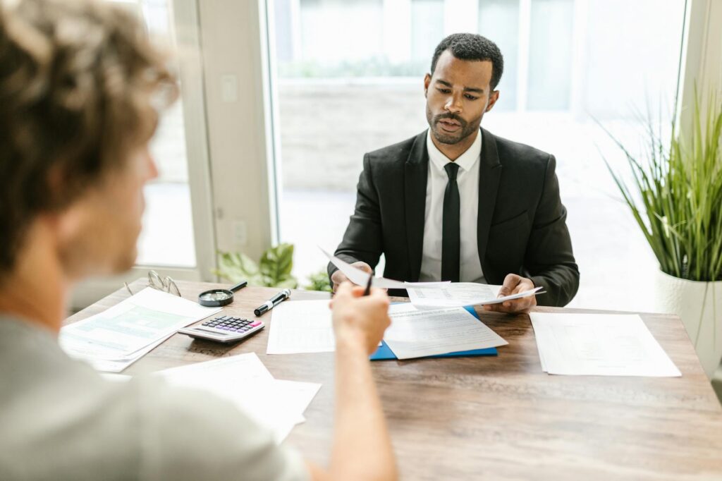 Business owner reviewing MCA documents with a financial specialist