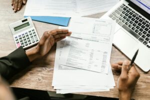Business owner calculating true cost of MCA factor rate advance