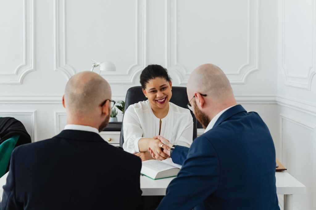 Business owner completing MCA debt settlement negotiation with positive outcome