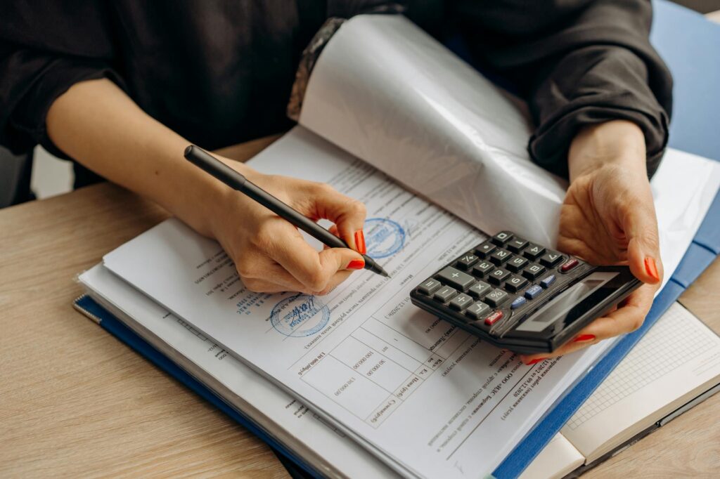 Business owner calculating true cost of reverse consolidation before signing