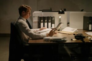 Business owner reviewing MCA contract paperwork at desk