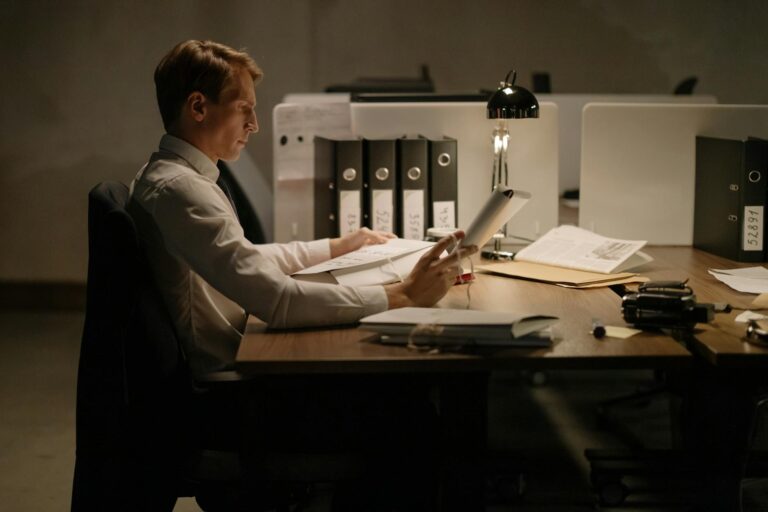 Business owner reviewing MCA contract paperwork at desk