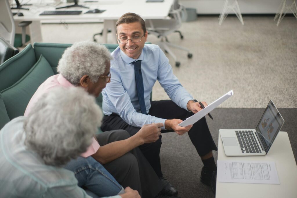 MCA relief specialist reviewing debt restructuring options with business owners