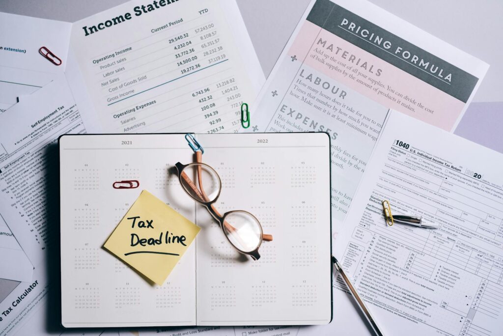 Calendar showing June 15 estimated tax deadline with contractor financial paperwork