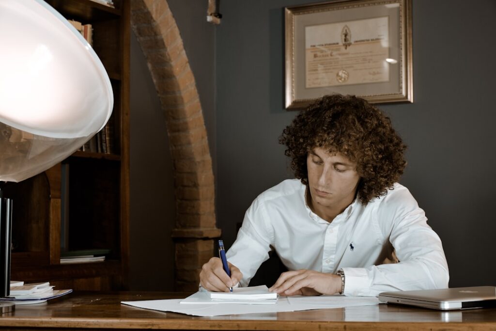 Small business owner reviewing a legal notice from an MCA funder at their office desk
