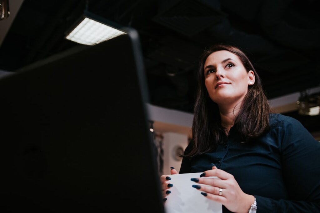 Small business owner reviewing MCA paperwork at desk