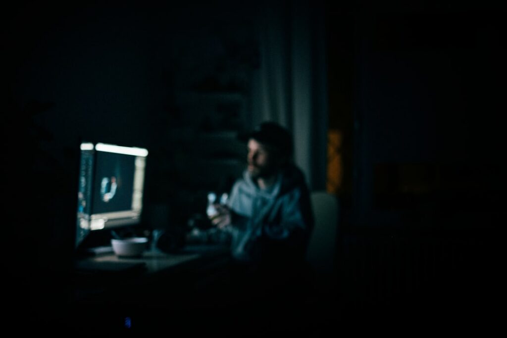 Business owner reviewing MCA payment paperwork late at night