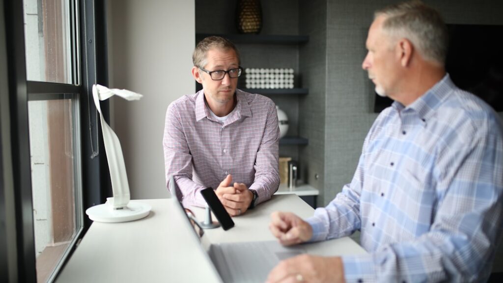 Small business owner discussing financial restructuring options with an advisor