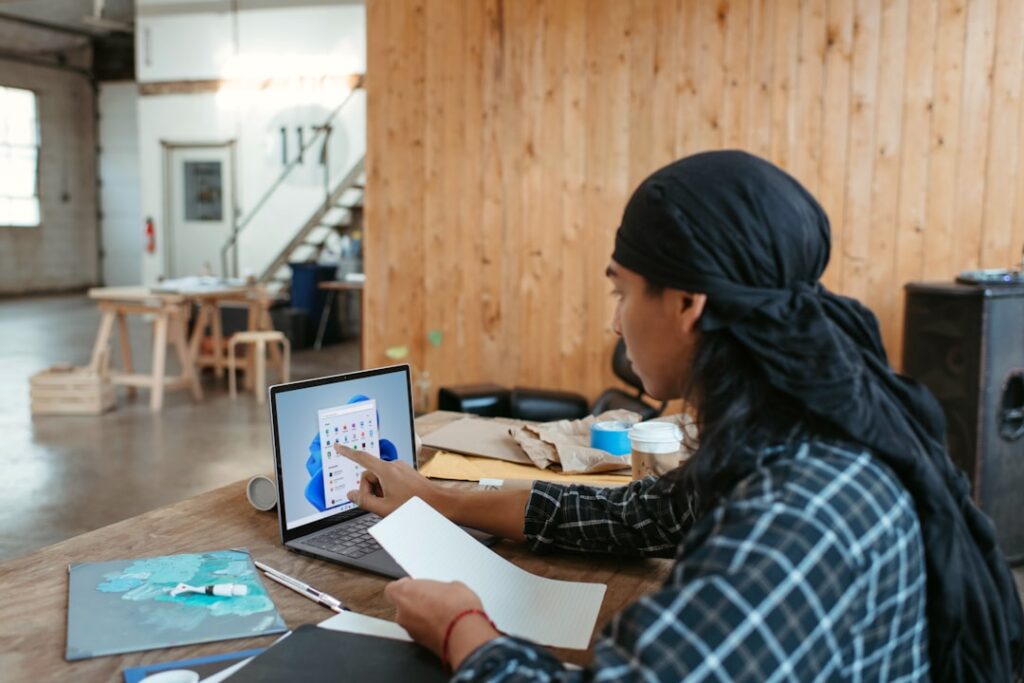 Business owner reviewing MCA payment ratios against monthly revenue on spreadsheet