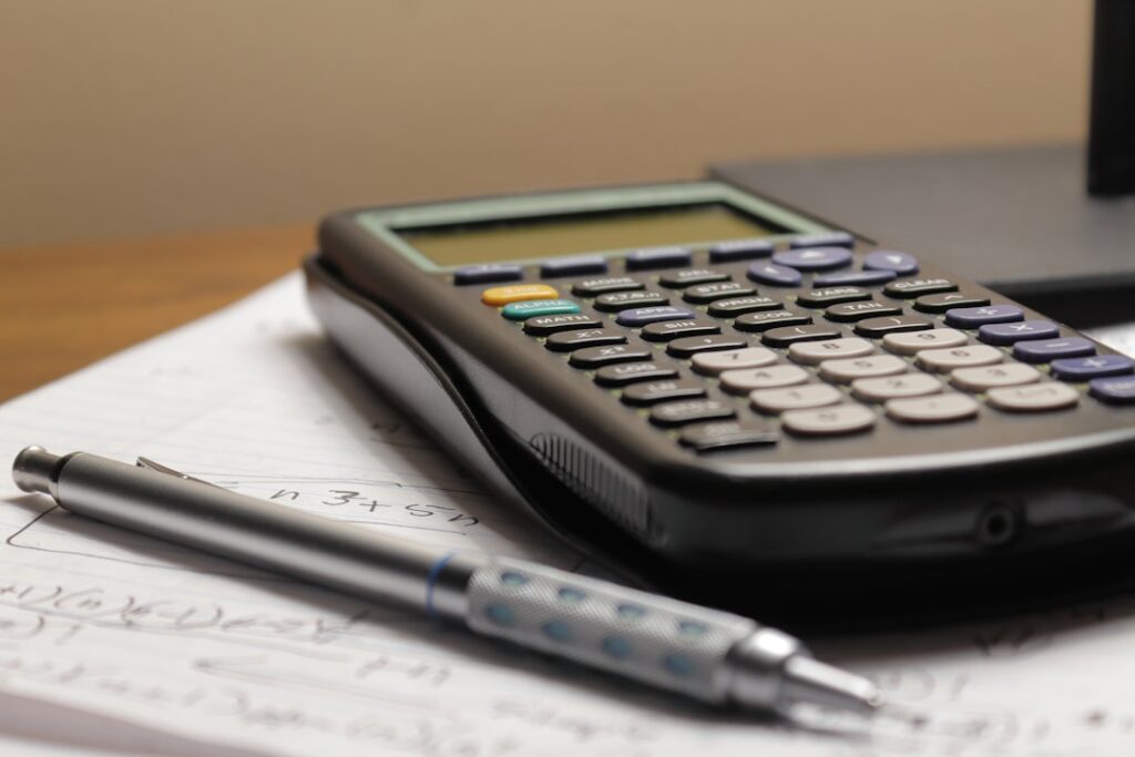 Business bank statements and MCA contract documents on desk