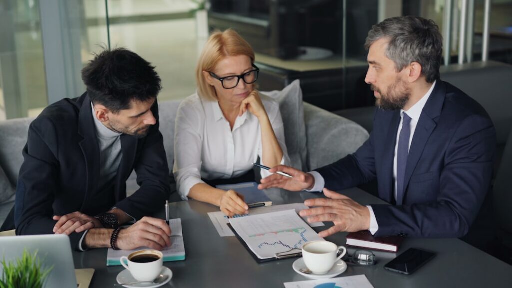 Business advisor explaining structured MCA payment plan to owner