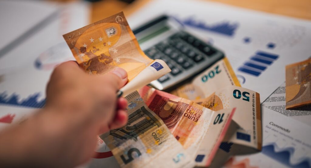 Business owner calculating total MCA payments across multiple advances
