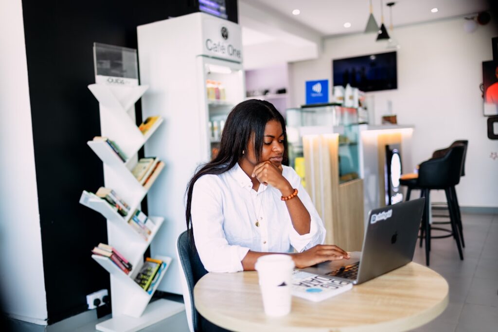 Small business owner reviewing SBA loan documents at office desk