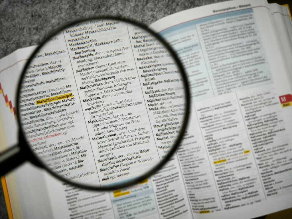 Magnifying glass over fine print in a financial contract