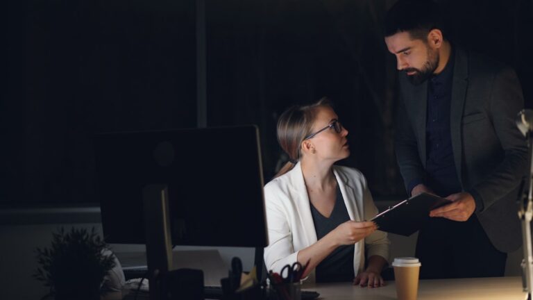 Small business owner and accountant reviewing MCA debt-service analysis