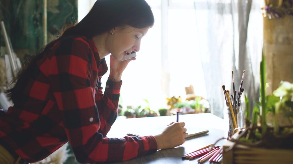 Small business owner making a call about MCA debt restructuring options