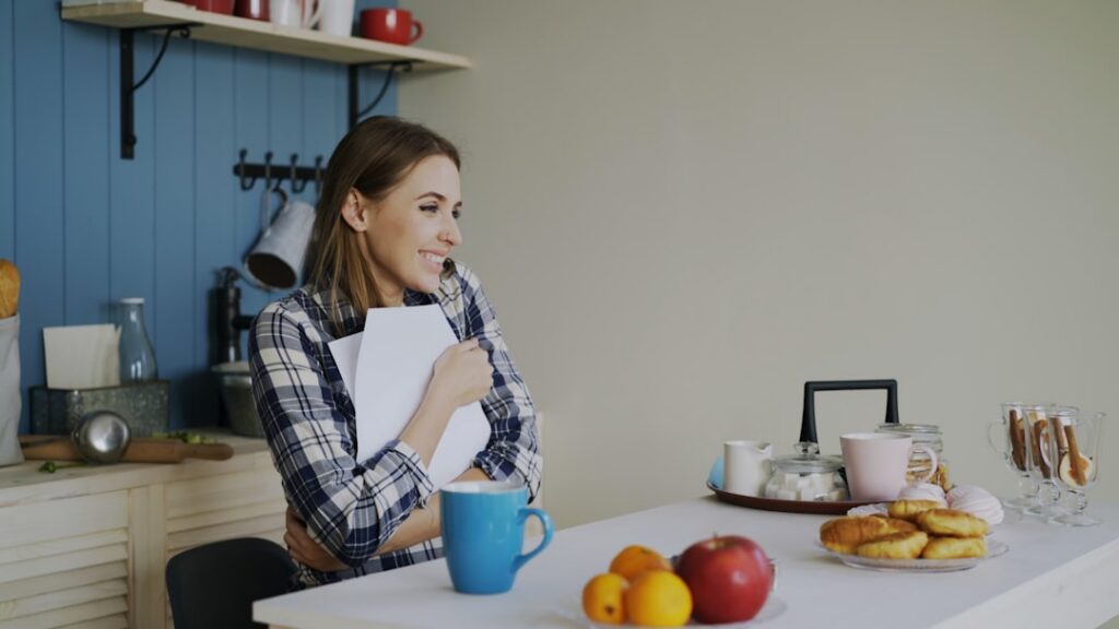 Small business owner reviewing MCA contract and legal documents at desk