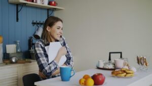 Small business owner reviewing MCA contract and legal documents at desk