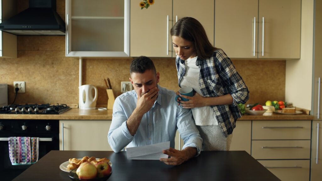 Small business owner reading an MCA legal notice at their desk