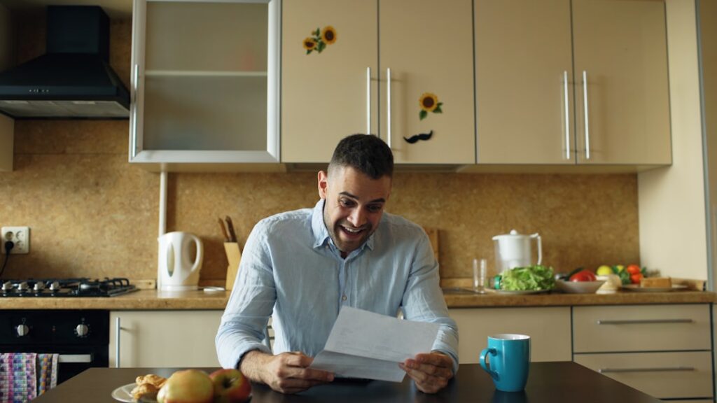 Small business owner reviewing MCA disclosure documents at desk
