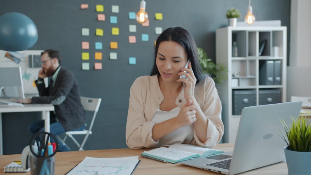 Small business owner calling MCA relief specialist for help with debt