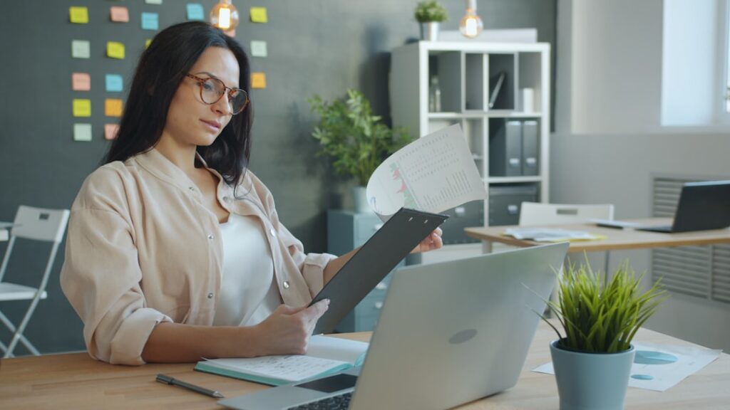 Business owner carefully reading a contract document at a desk