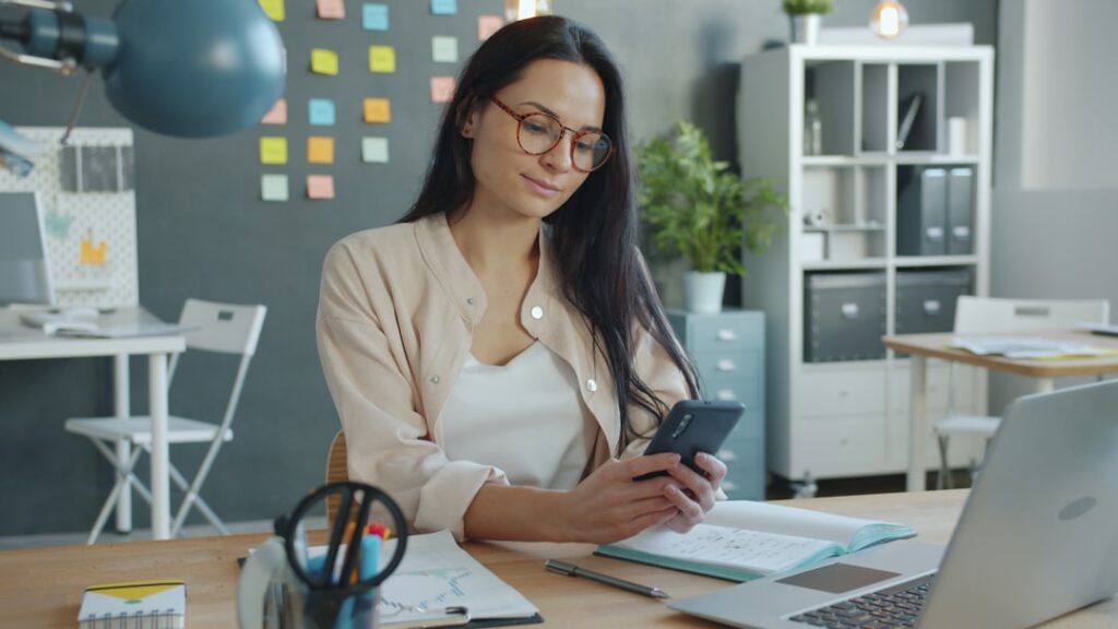 Small business owner reviewing a legal settlement document at their desk