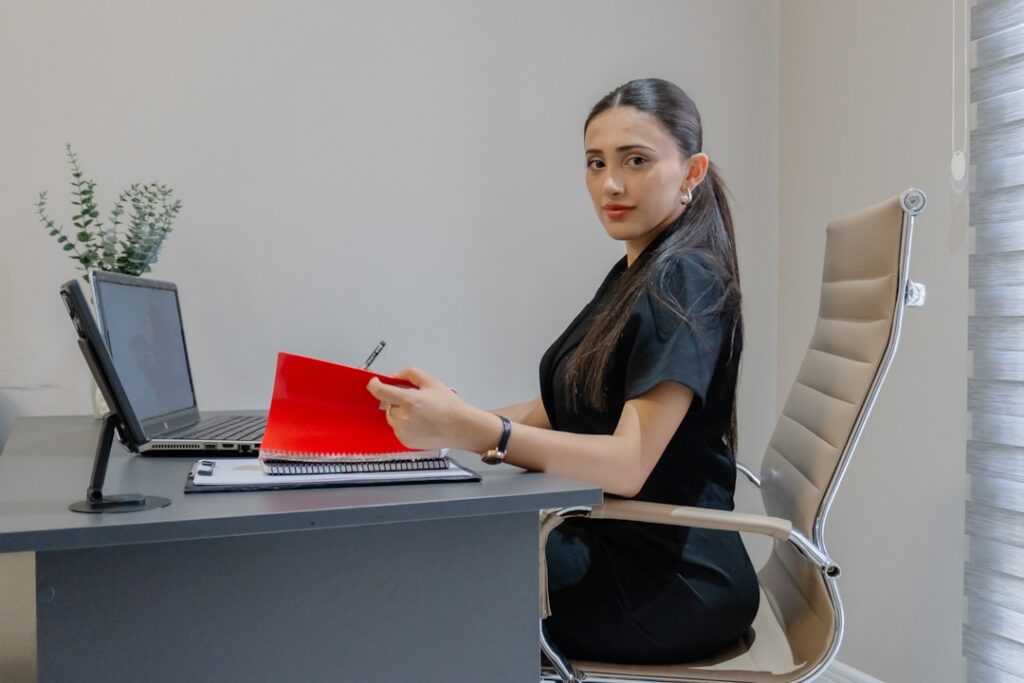 MCA relief specialist and retail boutique owner reviewing settlement agreement documents