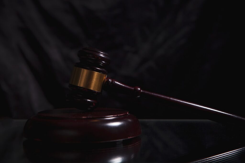Legal gavel and documents representing MCA enforcement actions and court proceedings