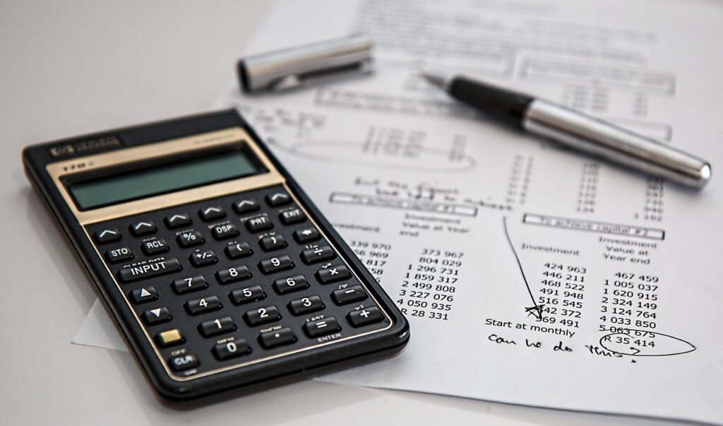 Small business owner on phone with MCA advisor reviewing default documents