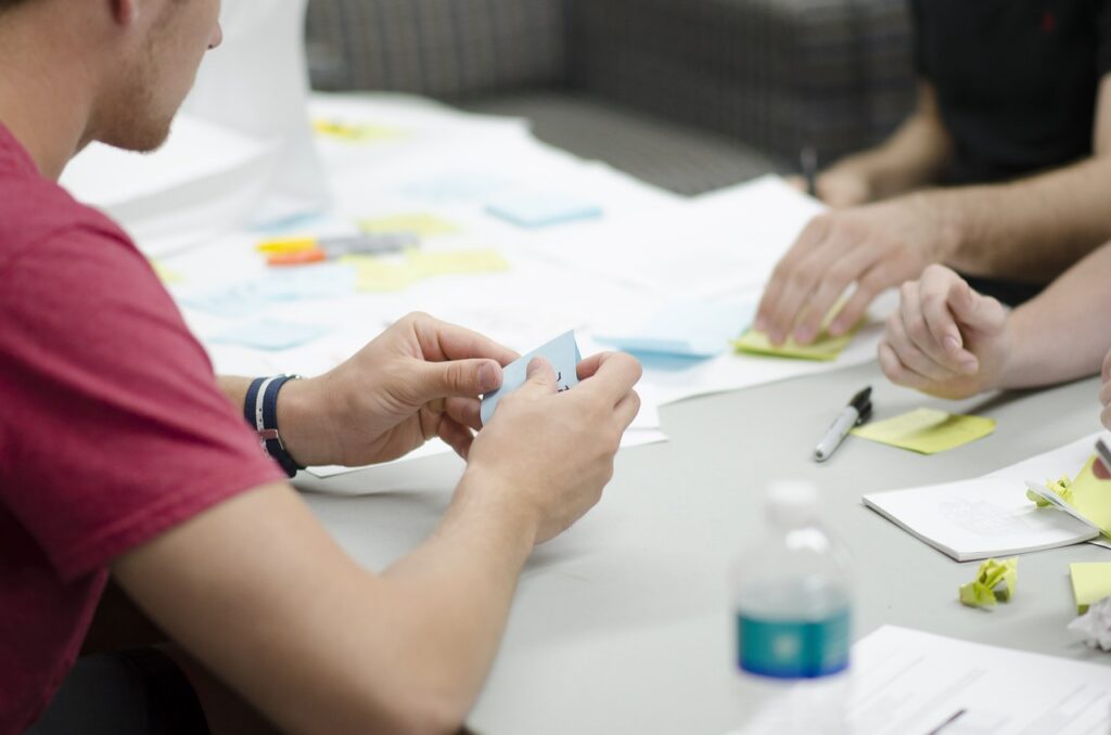 Financial negotiation meeting with documents showing multiple creditor positions
