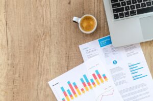 Small business owner reviewing MCA debt documents while considering business closure options