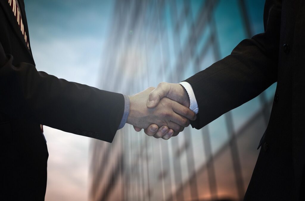 Business owners negotiating MCA settlement at desk