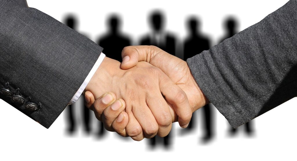 Business owners negotiating MCA settlement terms across a desk