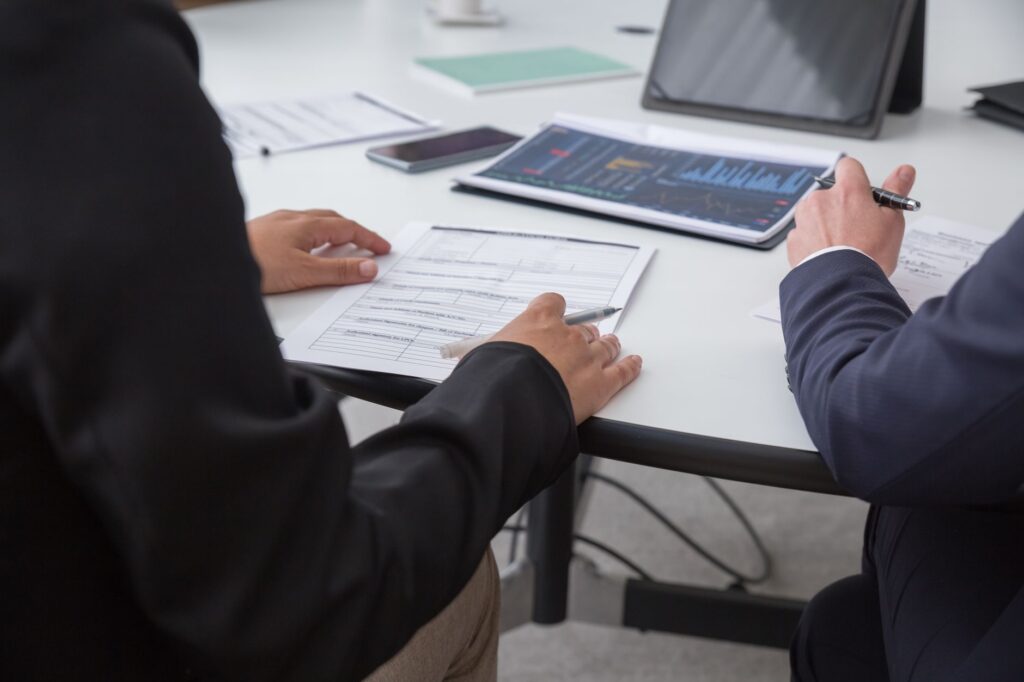 MCA settlement negotiation between business representatives at conference table