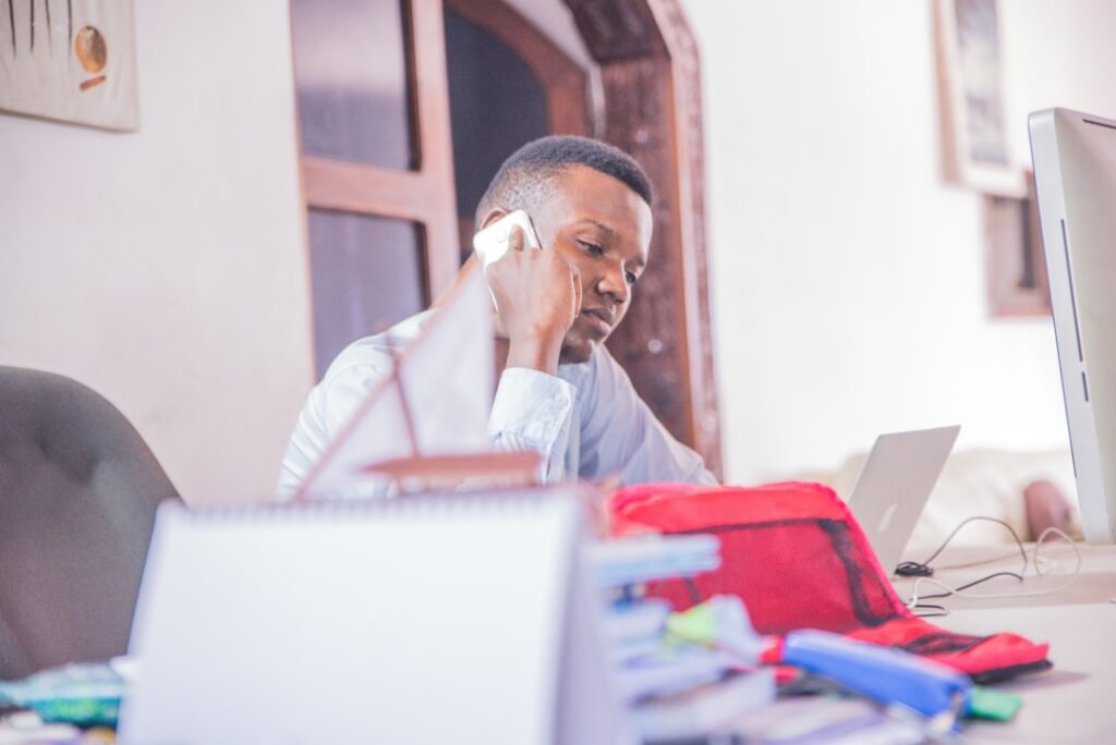 Small business owner calling an MCA relief specialist to discuss closure options