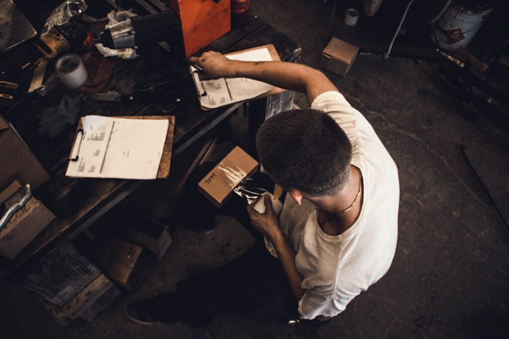 Stressed small business owner struggling alone with MCA debt paperwork
