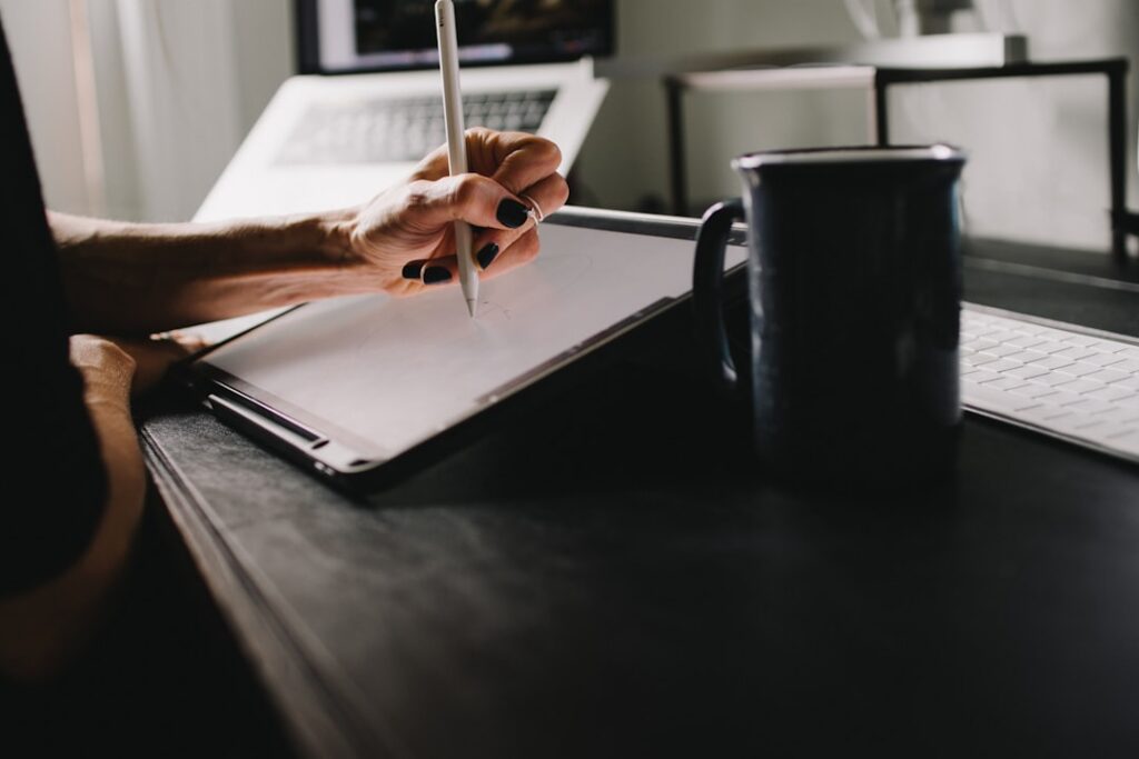 Small business owner writing a formal hardship letter at their office desk