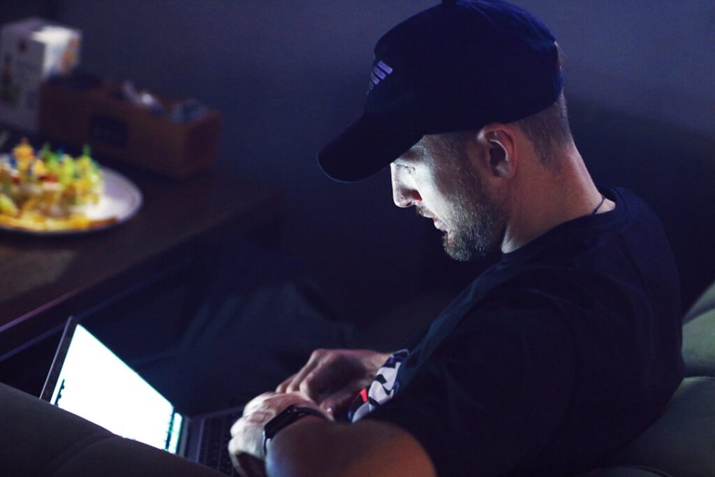 Business owner reviewing MCA financial documents at desk late at night
