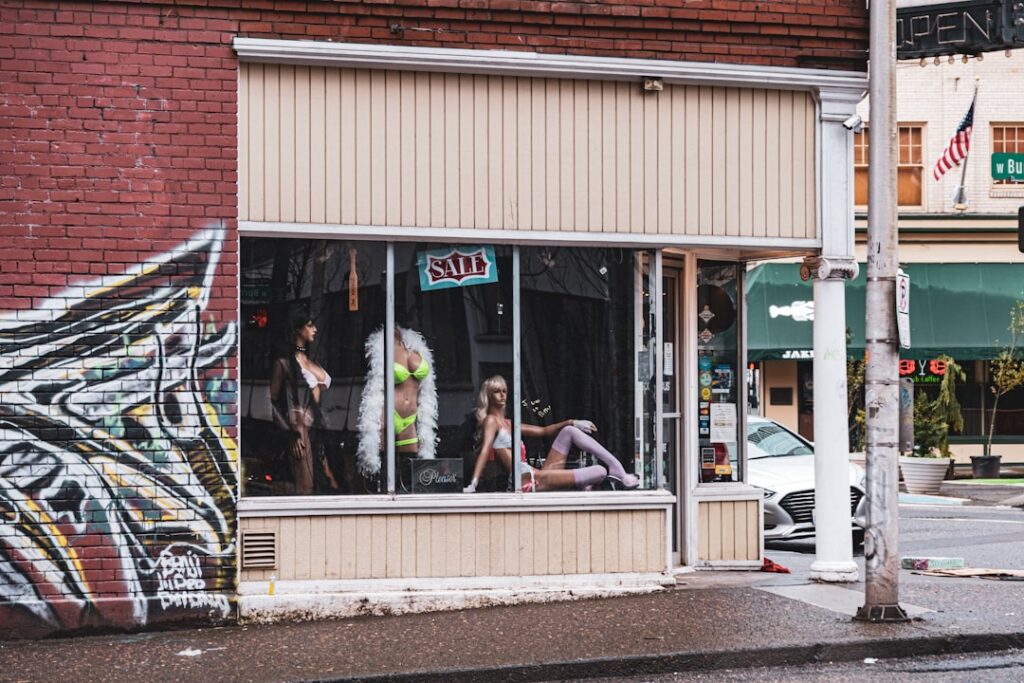 Small business with for-sale sign representing a business exit process