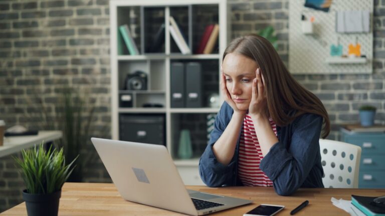 Small business owner reviewing bank statements after a missed MCA payment