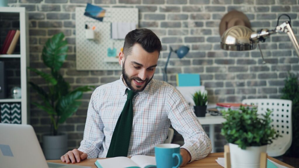 Small business owner reviewing tax documents and financial paperwork at desk