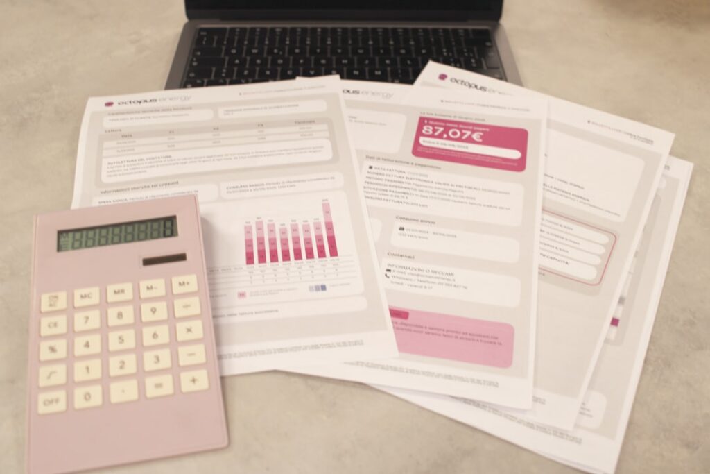 Overdue MCA payment notices and business financial documents on a desk